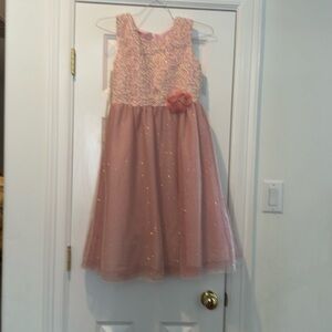 A designer dress size 16. Very elegant and sophisticated Good for holiday season